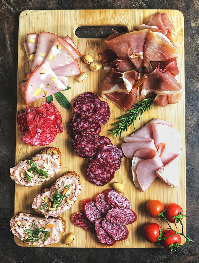 sliced-meats-on-wooden-chopping-board-1927383